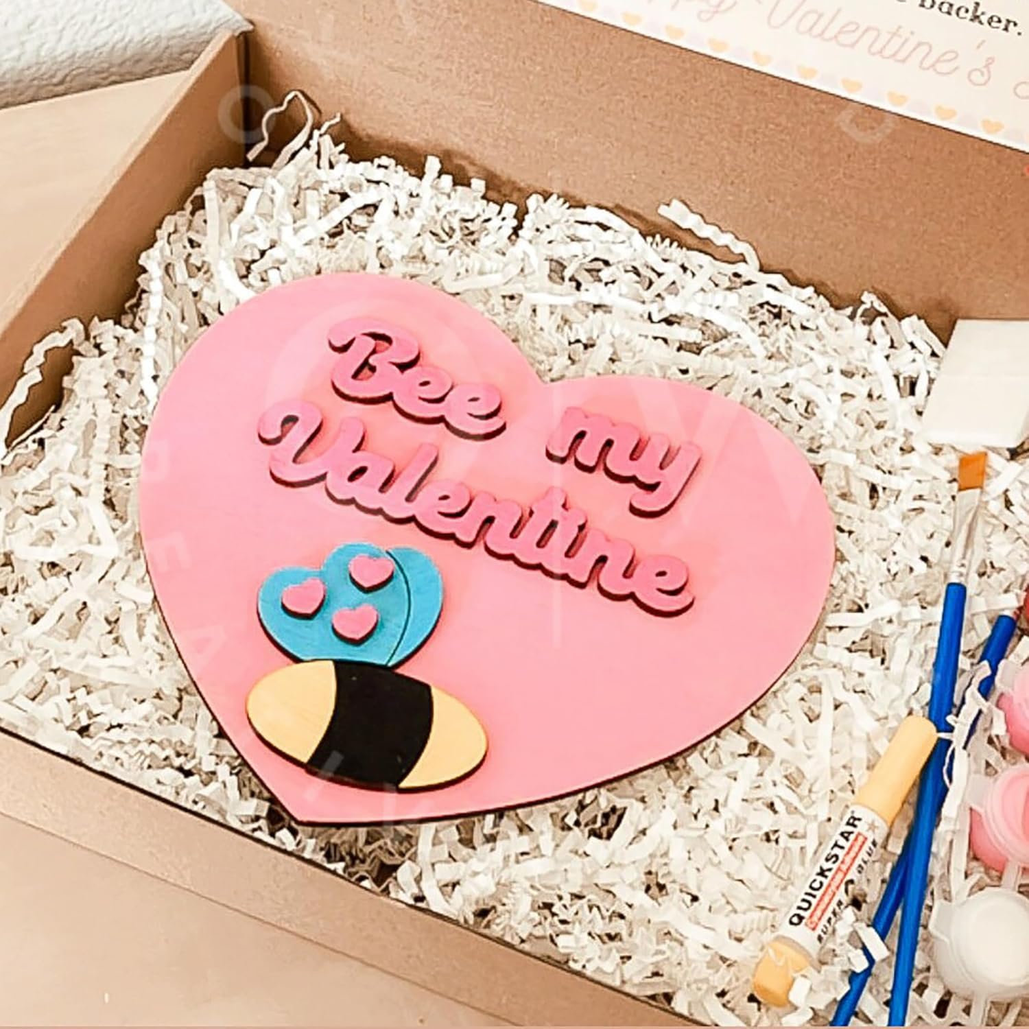 Heart-shaped pink plaque with 'Bee my Valentine' text in a box with white filler