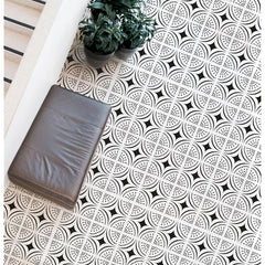 Patterned floor with a plant and cushion