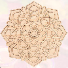 Decorative wooden mandala on a light pink background