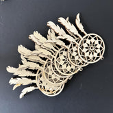 Wooden dreamcatcher ornament on a black background