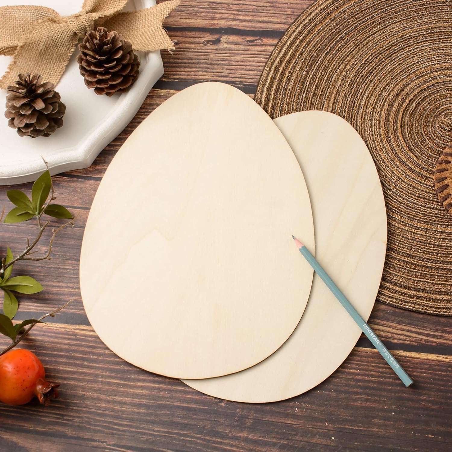Two wooden round placemats with a pencil on a wooden surface, surrounded by decorative elements.
