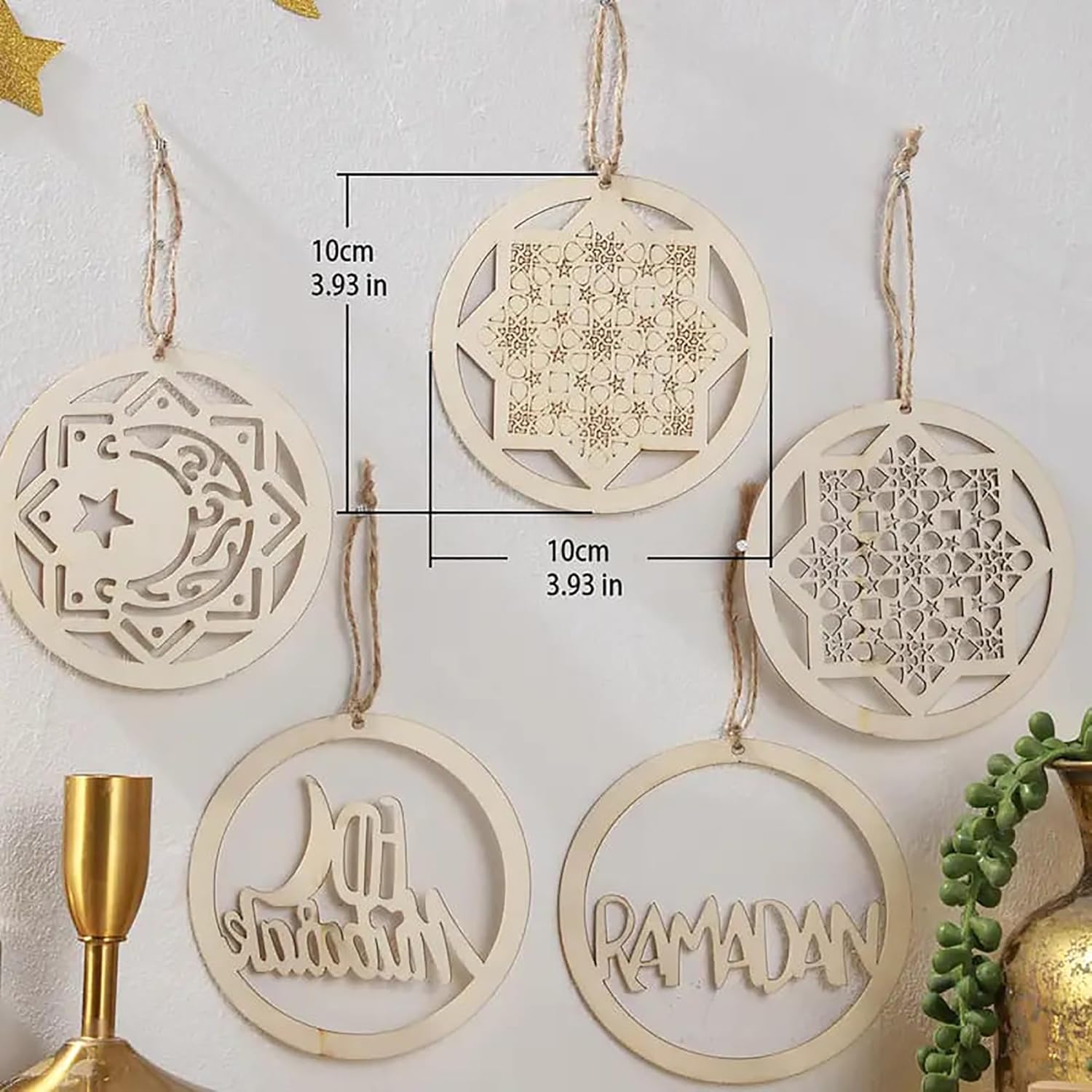 Decorative wooden ornaments with geometric patterns and 'Ramadan' text on a light background.