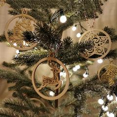 Close-up of a Christmas tree with wooden reindeer ornaments and string lights.