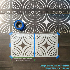 Decorative tile stencil with a geometric pattern on a wooden surface.