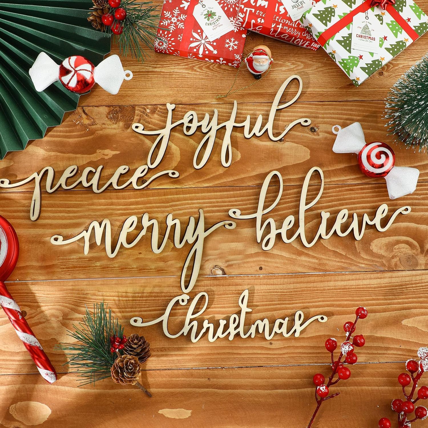 Wooden Christmas sign with decorative elements on a wooden surface
