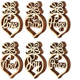 Set of six wooden heart-shaped decorations with engraved words on a white background