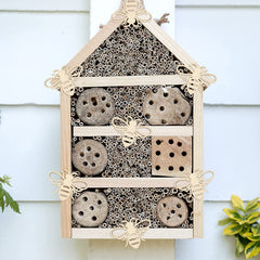 Beeswax insect house with natural elements on a white background