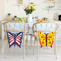 Butterfly-shaped decorations on chairs in a kitchen setting