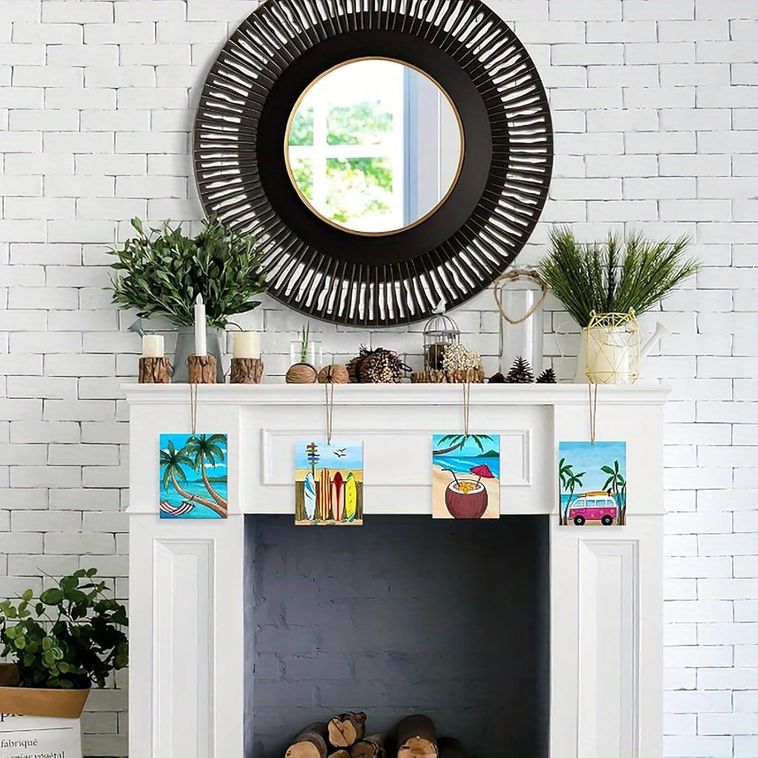 Decorative mantel with a black round mirror, plants, and small colorful artworks against a white brick wall.