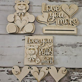 Wooden decorative items with 'Love you more' and 'Love you BEARY much' text on a rustic wooden background.