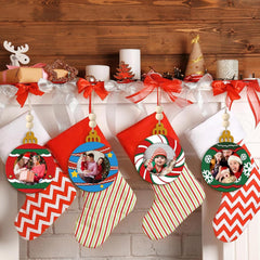 Decorative stockings with photo ornaments on a wooden mantel.
