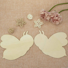 Butterfly wings on a textured fabric background with decorative elements.