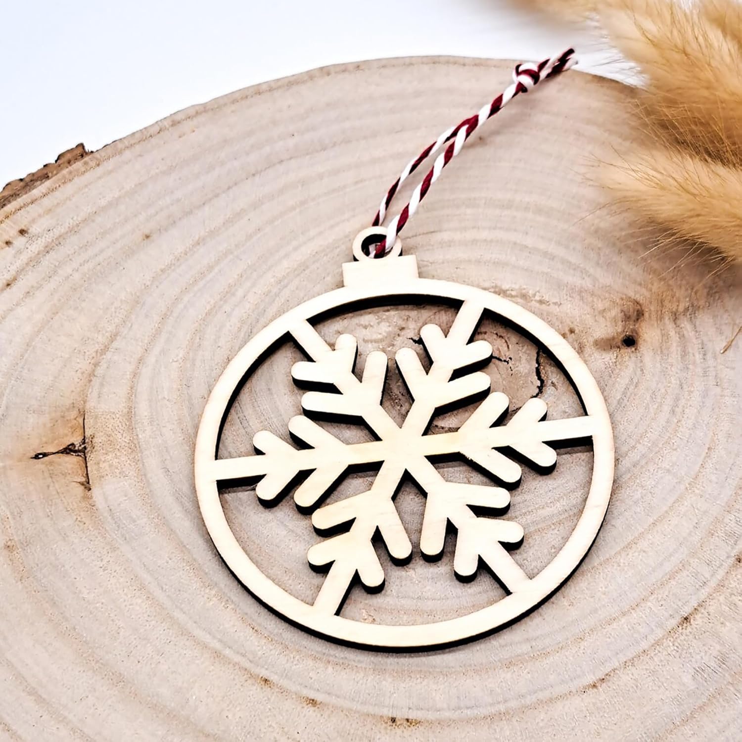 Wooden snowflake ornament on a wooden surface
