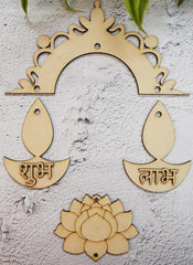 Wooden decorative items with arch, fish shapes, and lotus on a textured surface