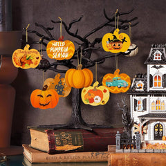 Halloween-themed decorations including pumpkins and a haunted house on a dark background.