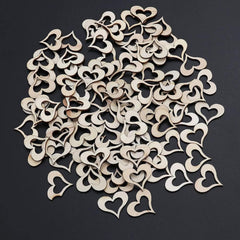 Wooden heart-shaped cutouts on a black background