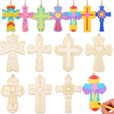 Colorful wooden cross ornaments with a hand holding a paintbrush.