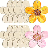 Set of wooden flower-shaped tags with painted flowers on a white background