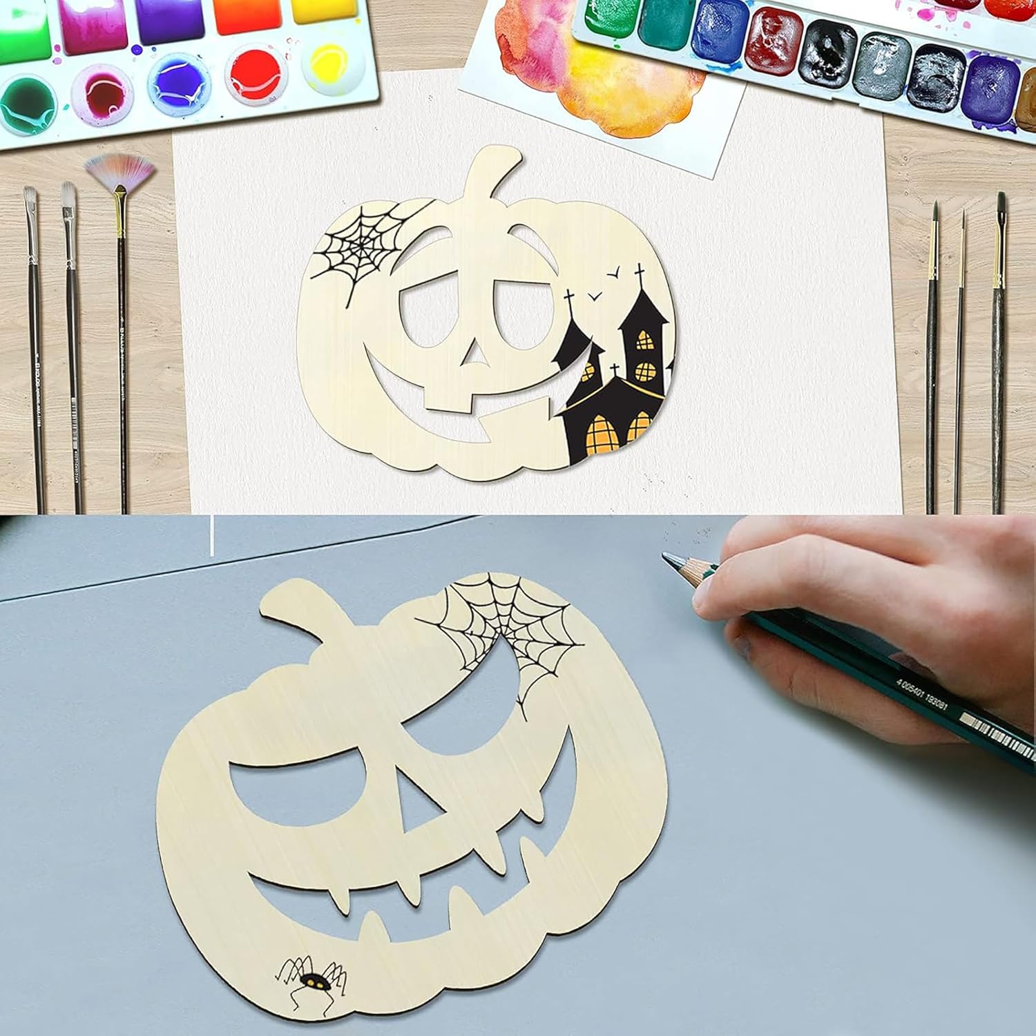 Wooden pumpkin carving stencils with Halloween designs on a table with watercolor paints and brushes.