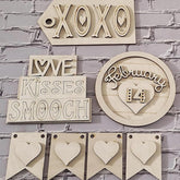 Decorative wooden signs with phrases and hearts on a brick wall background