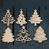Set of wooden Christmas tree ornaments on a dark wooden background