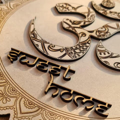 Decorative wooden cutout with 'Sweets for the Home' text and intricate designs on a beige background