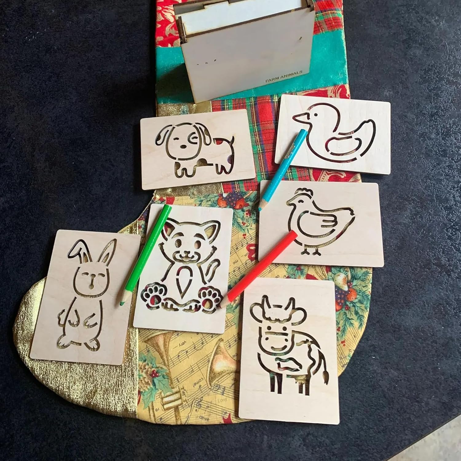Set of animal stencils on a colorful fabric background