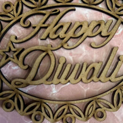 Decorative cutout with 'Happy Diwali' text on a pink marble background
