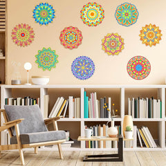 Colorful mandala wall decors on a beige wall above a bookshelf with books and decor items.
