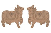 Two decorative cow-shaped items with intricate patterns on a white background