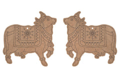 Two decorative cow-shaped items with intricate patterns on a white background
