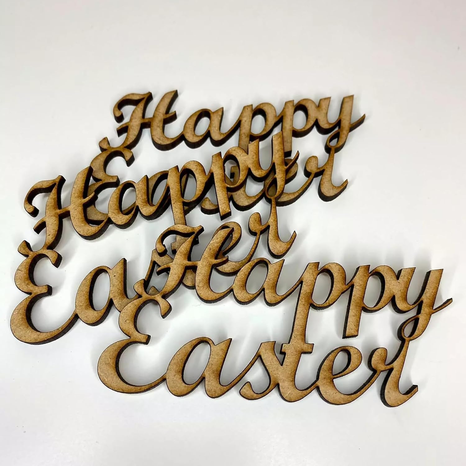 Wooden cutout letters spelling 'Happy Easter' on a white background