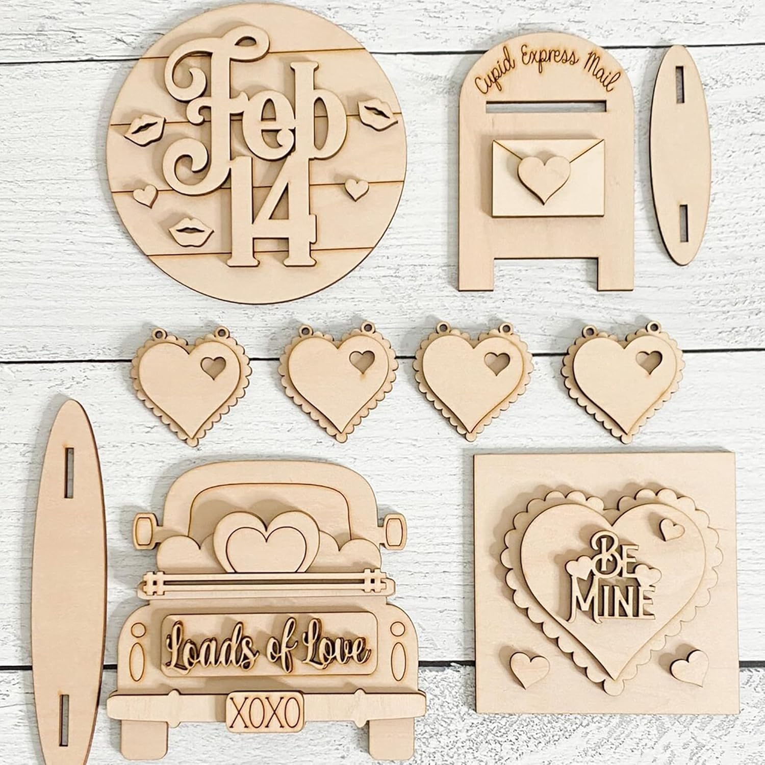 Collection of wooden情人节 decorations on a light wooden background