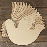 Wooden dove cutout on a wooden background