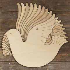 Wooden dove cutout on a wooden background