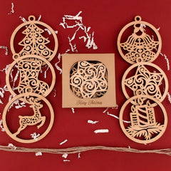 Wooden Christmas ornaments on a red background with a box of ornaments.
