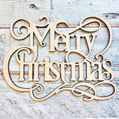 Wooden 'Merry Christmas' decoration on a rustic wooden background