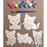 Coloring kit with cat designs and paint bottles on a brown background