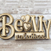 Wooden decorative sign with 'Be My Valentine' text on a wooden background