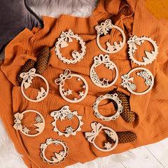 Wooden decorative wreaths on an orange fabric background