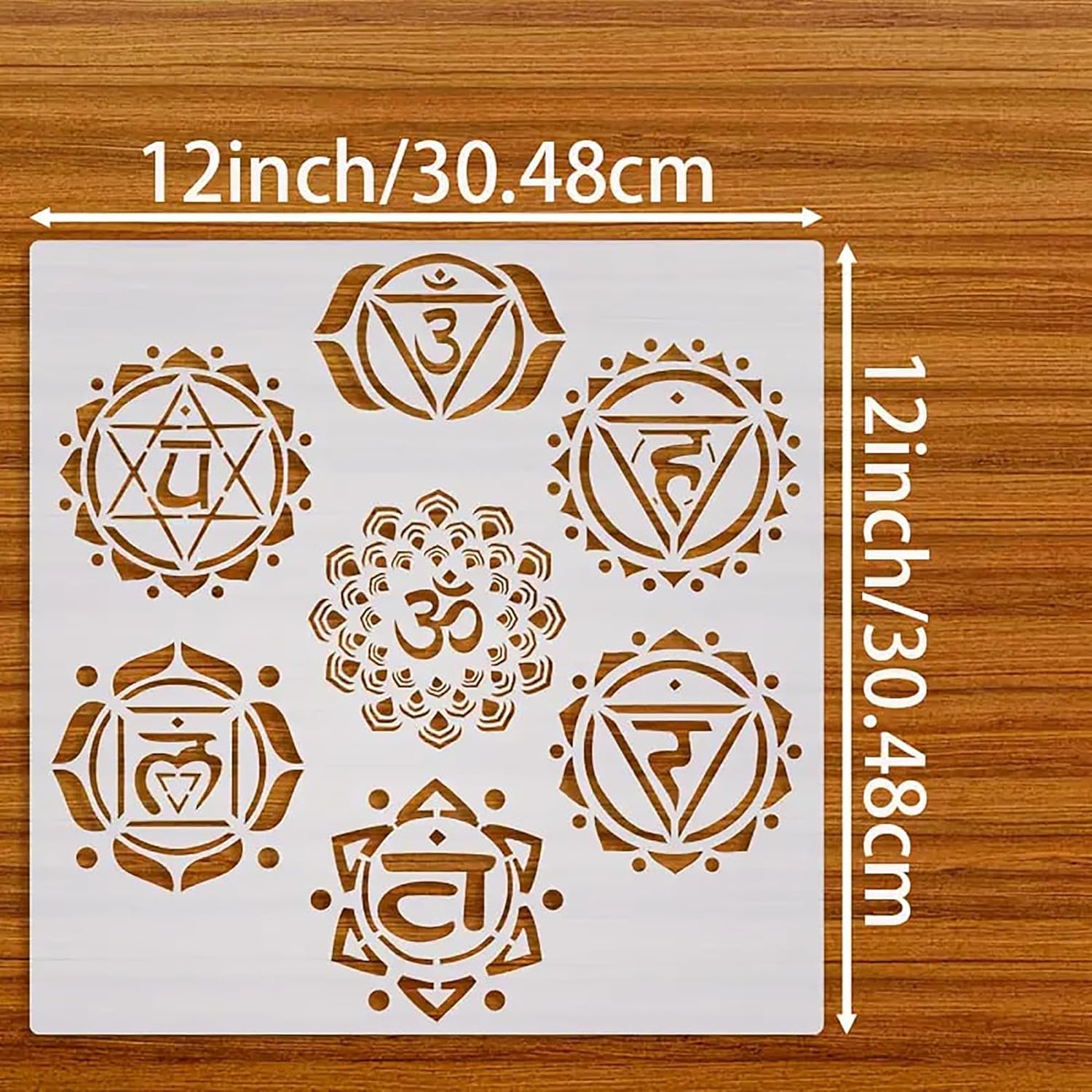 Sheet of chakra symbols with measurements on a wooden background