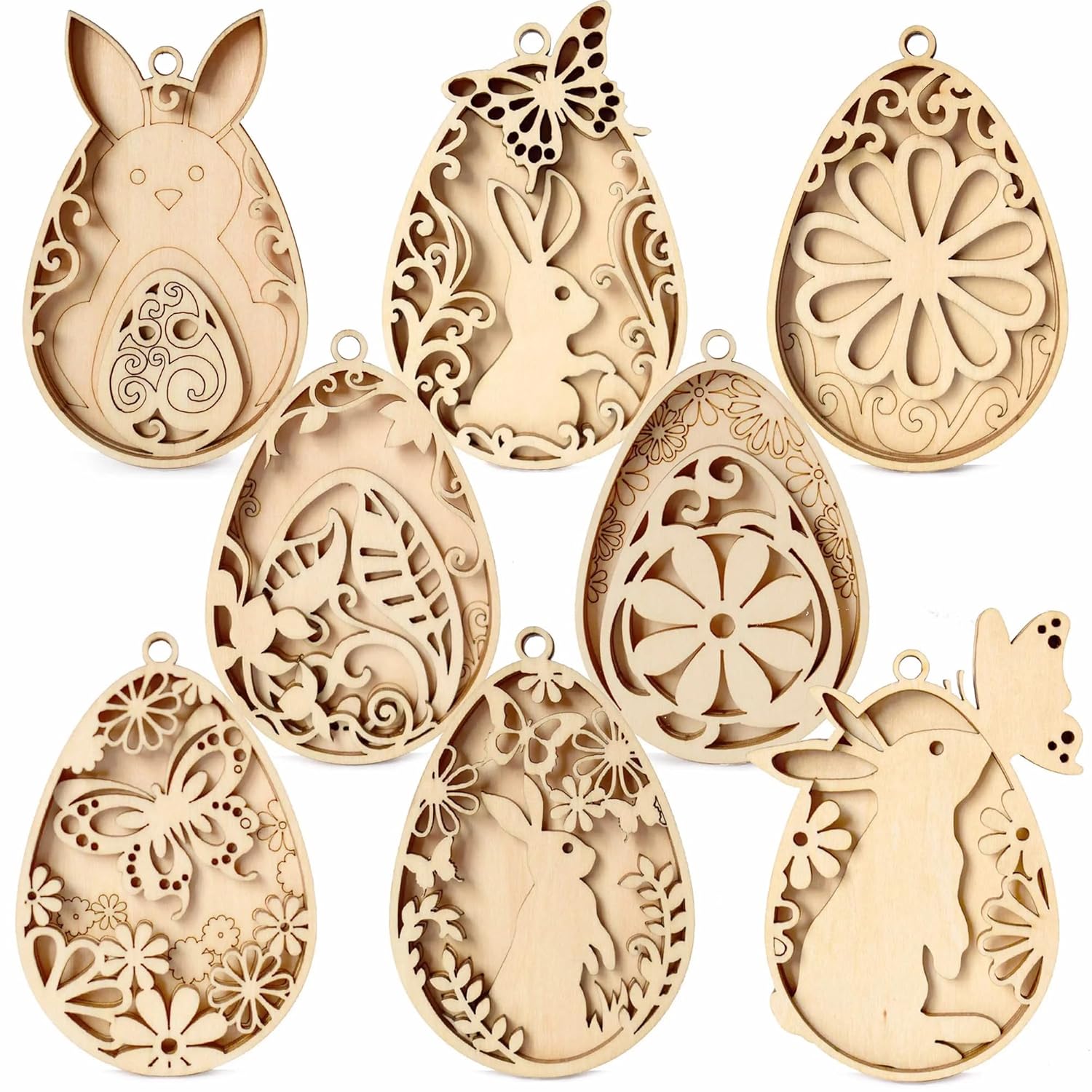 Set of decorative wooden Easter egg molds with rabbit and floral designs on a white background.