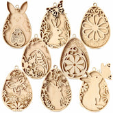 Set of decorative wooden Easter egg molds with rabbit and floral designs on a white background.