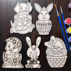 Set of Easter-themed coloring pages with paintbrushes and paint on a wooden surface