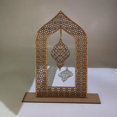 Decorative wooden arch with intricate cut-out patterns on a plain background