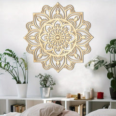 Decorative gold mandala wall art in a room with plants and shelves.