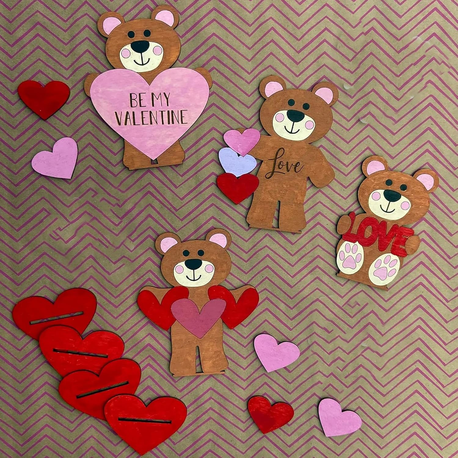 Valentine-themed wooden bears with hearts on a chevron patterned background