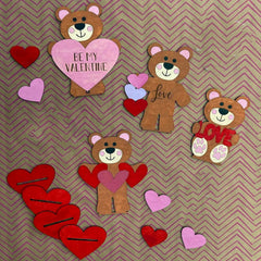 Valentine-themed wooden bears with hearts on a chevron patterned background