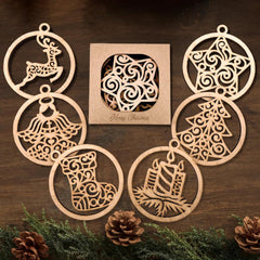 Set of wooden Christmas ornaments with intricate designs on a wooden surface.