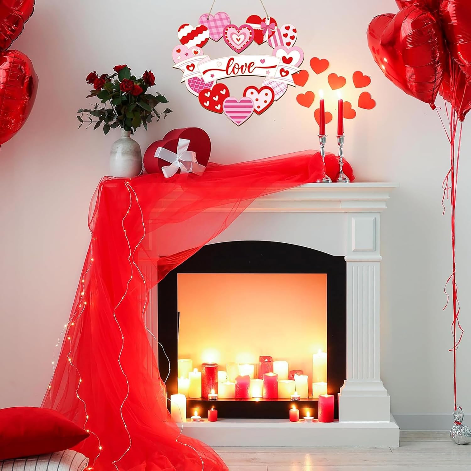 Decorated room with a fireplace, red balloons, and heart-themed decorations.